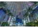 Night shot of high-rise condominium towers with palm trees and porte cochere at 4525 Dean Martin Dr # 911, Las Vegas, NV 89103
