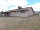 Spacious backyard with a covered patio and minimal landscaping at 4601 Diamond Head Dr, Las Vegas, NV 89110