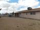 Spacious backyard with a covered patio and minimal landscaping at 4601 Diamond Head Dr, Las Vegas, NV 89110