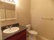 Functional bathroom with a granite countertop, single sink, and tiled floor at 4601 Diamond Head Dr, Las Vegas, NV 89110