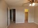 Neutral bedroom with neutral carpet, ceiling fan, closet and two doors at 4601 Diamond Head Dr, Las Vegas, NV 89110