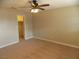Bedroom with carpet flooring, ceiling fan, and walk-in closet at 4601 Diamond Head Dr, Las Vegas, NV 89110