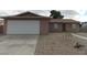 Cozy single-story home featuring a two-car garage and desert landscaping at 4601 Diamond Head Dr, Las Vegas, NV 89110