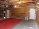Spacious garage with unfinished walls and ceiling and red carpet at 4601 Diamond Head Dr, Las Vegas, NV 89110