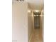 Neutral-toned hallway featuring tile flooring and a light fixture at 4601 Diamond Head Dr, Las Vegas, NV 89110
