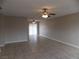 Open living room with tile flooring, ceiling fans, and a sliding glass door at 4601 Diamond Head Dr, Las Vegas, NV 89110