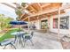 Charming backyard featuring covered patio, well-manicured lawn, and outdoor seating at 4730 Mountain Valley Rd, Las Vegas, NV 89121