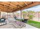 Charming backyard featuring covered patio, well-manicured lawn, and privacy fence at 4730 Mountain Valley Rd, Las Vegas, NV 89121