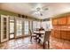 Sunlit dining space featuring tan tile flooring and wooden cabinets, creating a warm atmosphere at 4730 Mountain Valley Rd, Las Vegas, NV 89121