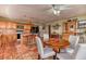 Open eat-in kitchen featuring tile floors, bar seating, and a dining area perfect for cooking and gatherings at 4730 Mountain Valley Rd, Las Vegas, NV 89121
