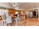 A view of a warm eat-in kitchen with tile floors and natural wood cabinets at 4730 Mountain Valley Rd, Las Vegas, NV 89121