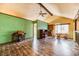 Upstairs living room featuring wood floors, ample lighting, and vaulted ceiling at 4730 Mountain Valley Rd, Las Vegas, NV 89121