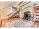 Inviting living room featuring staircase, wood floors, high ceilings, and stylish decor at 4730 Mountain Valley Rd, Las Vegas, NV 89121
