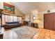 Comfortable living room with fireplace, wood floors, and ample natural light at 4730 Mountain Valley Rd, Las Vegas, NV 89121