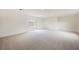 Spacious basement with neutral carpet, sliding glass doors, and ample natural light at 4790 E Cleveland Ave, Las Vegas, NV 89104