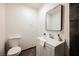 This bathroom includes a toilet, white vanity, and modern fixtures at 4790 E Cleveland Ave, Las Vegas, NV 89104