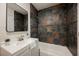 Beautiful bathroom featuring a tub, modern fixtures, and contemporary tile at 4790 E Cleveland Ave, Las Vegas, NV 89104