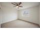 Bedroom featuring a ceiling fan, neutral carpet, white walls and a window at 4790 E Cleveland Ave, Las Vegas, NV 89104