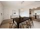 Elegant dining room features a wooden table, stylish chairs, modern light fixture, and tasteful decor at 4790 E Cleveland Ave, Las Vegas, NV 89104