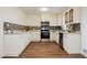 Bright kitchen with white cabinets, stainless steel appliances, granite countertops and decorative backsplash at 4790 E Cleveland Ave, Las Vegas, NV 89104