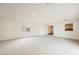 Large, empty living room with neutral carpet, natural light, and recessed lighting at 4790 E Cleveland Ave, Las Vegas, NV 89104