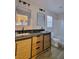 Bathroom featuring double vanity, framed mirrors, modern lighting, and a shower/tub combo at 4823 Jubilee Diamond Ct, Las Vegas, NV 89139