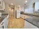 Efficient kitchen featuring white cabinetry, modern countertops, and tile flooring with appliances and plenty of storage at 4823 Jubilee Diamond Ct, Las Vegas, NV 89139