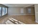 Spacious living area featuring tile flooring, neutral walls, and multiple windows providing lots of natural light at 4823 Jubilee Diamond Ct, Las Vegas, NV 89139