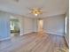 Large main bedroom featuring wood-look floors, natural light, and an ensuite bathroom at 4823 Jubilee Diamond Ct, Las Vegas, NV 89139