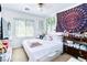 Well-lit bedroom with eclectic decor and personal touches at 5040 Copperlyn St, Las Vegas, NV 89122