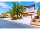 Street view of a charming, two-story home with a well-maintained front yard at 5040 Copperlyn St, Las Vegas, NV 89122