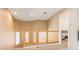 Hallway view features wood railing and staircase with natural light from windows at 5040 Copperlyn St, Las Vegas, NV 89122