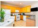 Functional kitchen with wooden cabinets and tile flooring at 5040 Copperlyn St, Las Vegas, NV 89122