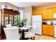 Bright kitchen with dining area, tile floors and wooden cabinets at 5040 Copperlyn St, Las Vegas, NV 89122