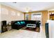 Bright living room with tiled floors, and a sectional sofa at 5040 Copperlyn St, Las Vegas, NV 89122