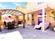 Spacious patio featuring covered seating areas, barbecue, and ample room for outdoor entertaining at 5040 Copperlyn St, Las Vegas, NV 89122