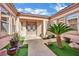 Charming courtyard area with an ornate entrance and desert-friendly landscaping at 5192 Estasi St, Las Vegas, NV 89135