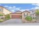 Charming single story home featuring a lush front yard and a two car garage at 5344 Bocopa St, Las Vegas, NV 89148