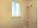 Bathroom with a shower and window at 5406 Indigo Hills St, North Las Vegas, NV 89031