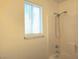 Bathroom features tiled shower with a window at 5406 Indigo Hills St, North Las Vegas, NV 89031