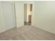 Carpeted bedroom boasts large closet and access to other rooms at 5406 Indigo Hills St, North Las Vegas, NV 89031