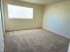 Bedroom featuring neutral carpet, a window, closet and painted walls at 5406 Indigo Hills St, North Las Vegas, NV 89031
