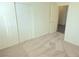 Carpeted bedroom offers access to closet and another room at 5406 Indigo Hills St, North Las Vegas, NV 89031