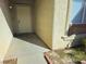 Covered front entrance with a white door and stucco exterior at 5406 Indigo Hills St, North Las Vegas, NV 89031