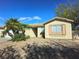 Charming single-story home with desert landscaping, mature trees and a two car garage at 5406 Indigo Hills St, North Las Vegas, NV 89031