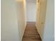 Hallway featuring wood flooring, a doorway, and a painted wall at 5406 Indigo Hills St, North Las Vegas, NV 89031