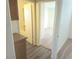 Hallway features wood-look floors, with access to bath and bedroom at 5406 Indigo Hills St, North Las Vegas, NV 89031