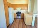 The kitchen features stainless steel appliances, countertops, wood cabinets, and wood flooring at 5406 Indigo Hills St, North Las Vegas, NV 89031