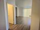 Living room features wood-look flooring and sliding glass doors at 5406 Indigo Hills St, North Las Vegas, NV 89031