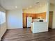 Bright, open-concept living room featuring wood flooring and natural light at 5406 Indigo Hills St, North Las Vegas, NV 89031